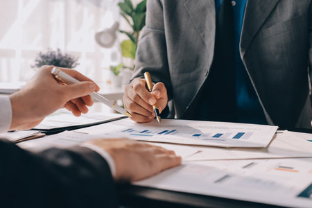 Accounting company provide finance and taxation planning for profitable cash flow, Auditor and accountant team working in office, analyze financial data and accounting record with calculator.Insightの写真素材