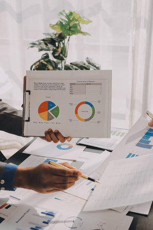 Accounting company provide finance and taxation planning for profitable cash flow, Auditor and accountant team working in office, analyze financial data and accounting record with calculator.Insightの写真素材