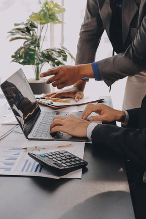 Accounting company provide finance and taxation planning for profitable cash flow, Auditor and accountant team working in office, analyze financial data and accounting record with calculator.Insightの写真素材