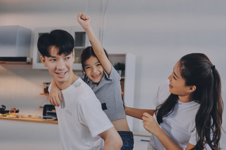 Family spends their free time togetherの写真素材