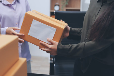 Portrait of Starting small businesses SME owners, two Asian woman check online orders Selling...