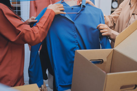 Portrait of Starting small businesses SME owners, two Asian woman check online orders Selling products working with boxs freelance work at home office, sme business online small medium enterpriseの写真素材
