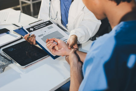 Young brunette woman having consultation at doctor office during
