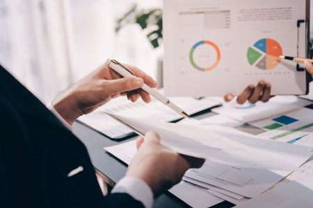 Accounting company provide finance and taxation planning for profitable cash flow, Auditor and accountant team working in office, analyze financial data and accounting record with calculator.Insightの写真素材