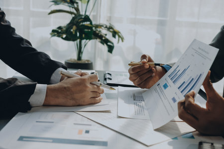 Accounting company provide finance and taxation planning for profitable cash flow, Auditor and accountant team working in office, analyze financial data and accounting record with calculator.Insightの写真素材