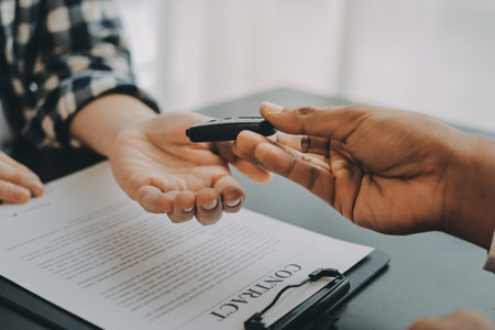 Car salesman gave the keys to the customers who signed the purchase contract legally, Successful...