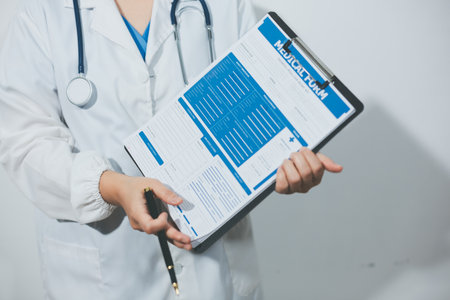 Portrait of female doctor, holding file
