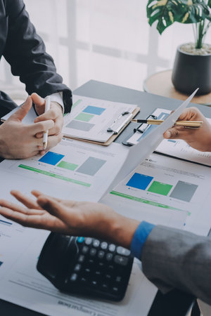 Accounting company provide finance and taxation planning for profitable cash flow, Auditor and accountant team working in office, analyze financial data and accounting record with calculator.Insightの写真素材