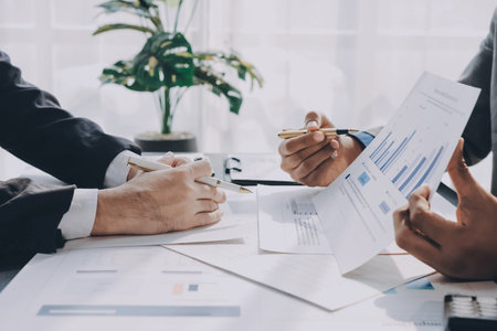 Accounting company provide finance and taxation planning for profitable cash flow, Auditor and accountant team working in office, analyze financial data and accounting record with calculator.Insightの写真素材