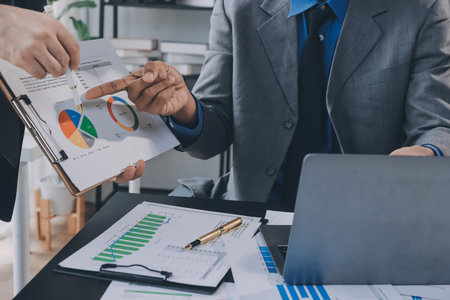 Accounting company provide finance and taxation planning for profitable cash flow, Auditor and accountant team working in office, analyze financial data and accounting record with calculator.Insightの写真素材