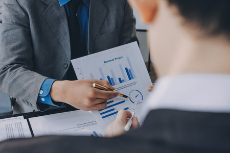 Accounting company provide finance and taxation planning for profitable cash flow, Auditor and accountant team working in office, analyze financial data and accounting record with calculator.Insightの写真素材