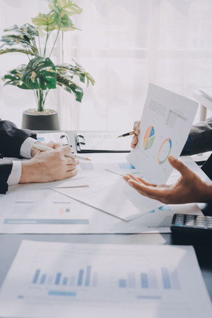 Accounting company provide finance and taxation planning for profitable cash flow, Auditor and accountant team working in office, analyze financial data and accounting record with calculator.Insightの写真素材