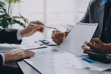 Accounting company provide finance and taxation planning for profitable cash flow, Auditor and accountant team working in office, analyze financial data and accounting record with calculator.Insightの写真素材