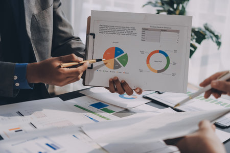 Accounting company provide finance and taxation planning for profitable cash flow, Auditor and accountant team working in office, analyze financial data and accounting record with calculator.Insightの写真素材