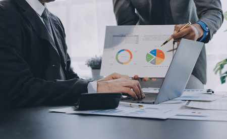 Accounting company provide finance and taxation planning for profitable cash flow, Auditor and accountant team working in office, analyze financial data and accounting record with calculator.Insightの写真素材