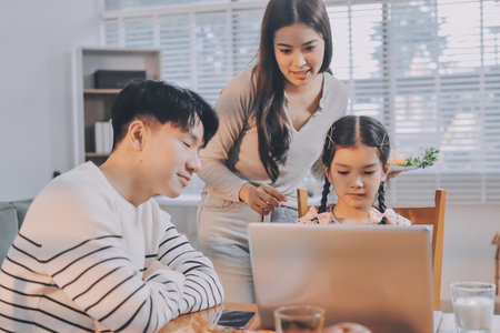 Family spends their free time togetherの写真素材