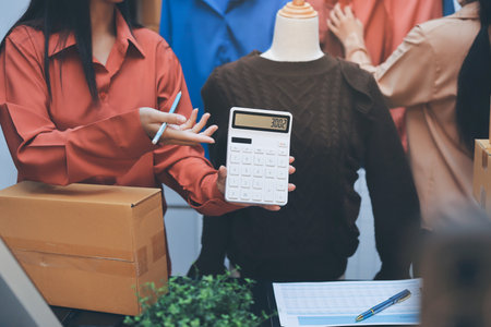 Portrait of Starting small businesses SME owners, two Asian woman check online orders Selling...