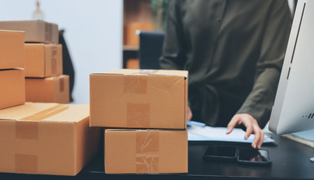 Portrait of Starting small businesses SME owners, two Asian woman check online orders Selling products working with boxs freelance work at home office, sme business online small medium enterpriseの写真素材