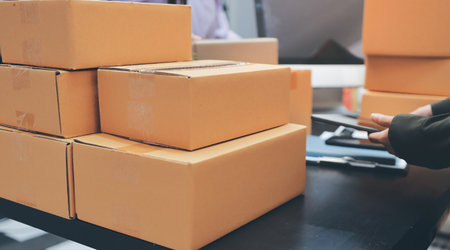 Portrait of Starting small businesses SME owners, two Asian woman check online orders Selling products working with boxs freelance work at home office, sme business online small medium enterpriseの写真素材