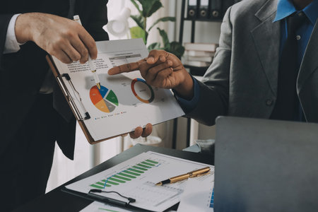 Accounting company provide finance and taxation planning for profitable cash flow, Auditor and accountant team working in office, analyze financial data and accounting record with calculator.Insightの写真素材