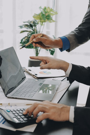 Accounting company provide finance and taxation planning for profitable cash flow, Auditor and accountant team working in office, analyze financial data and accounting record with calculator.Insightの写真素材
