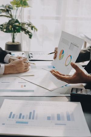 Accounting company provide finance and taxation planning for profitable cash flow, Auditor and accountant team working in office, analyze financial data and accounting record with calculator.Insightの写真素材