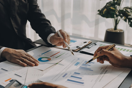 Accounting company provide finance and taxation planning for profitable cash flow, Auditor and accountant team working in office, analyze financial data and accounting record with calculator.Insightの写真素材