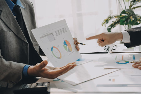 Accounting company provide finance and taxation planning for profitable cash flow, Auditor and accountant team working in office, analyze financial data and accounting record with calculator.Insightの写真素材