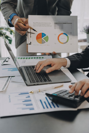 Accounting company provide finance and taxation planning for profitable cash flow, Auditor and accountant team working in office, analyze financial data and accounting record with calculator.Insightの写真素材