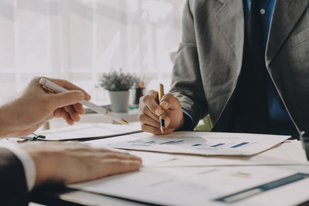 Accounting company provide finance and taxation planning for profitable cash flow, Auditor and accountant team working in office, analyze financial data and accounting record with calculator.Insightの写真素材