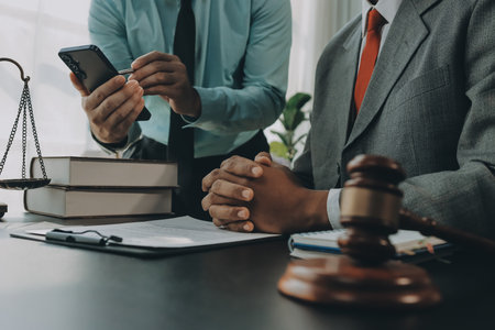 Lawyer explained to the client about the law that must be brought against the court case.の写真素材