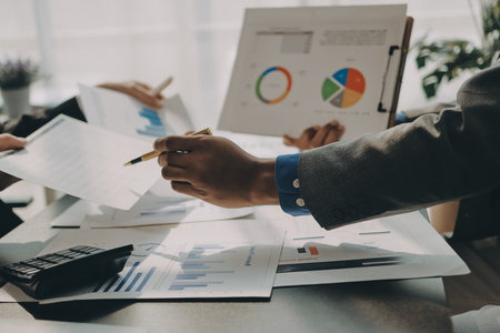 Accounting company provide finance and taxation planning for profitable cash flow, Auditor and accountant team working in office, analyze financial data and accounting record with calculator.Insightの写真素材