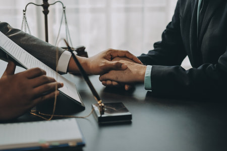 Lawyer explained to the client about the law that must be brought against the court case.の写真素材