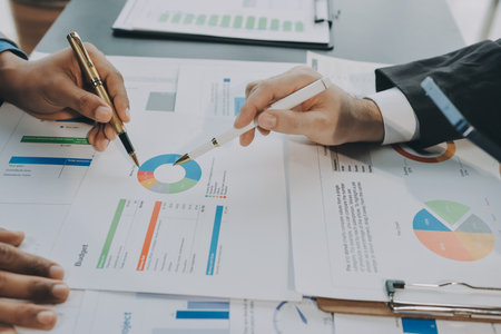 Accounting company provide finance and taxation planning for profitable cash flow, Auditor and accountant team working in office, analyze financial data and accounting record with calculator.Insightの写真素材