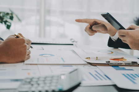 Accounting company provide finance and taxation planning for profitable cash flow, Auditor and accountant team working in office, analyze financial data and accounting record with calculator.Insightの写真素材