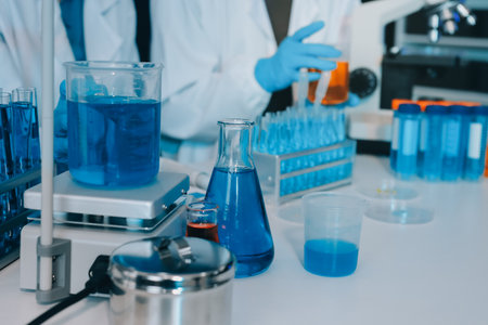 Collaboration, tablet or science with people in lab together for research or development. Innovation, tech and microscope with scientist team in clinical trial for planning or medical investigationの写真素材