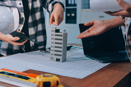 Construction and structure concept of engineer working drawing on blueprint meeting for project...