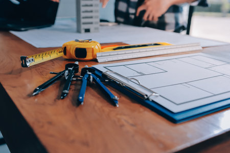 Construction and structure concept of engineer working drawing on blueprint meeting for project...