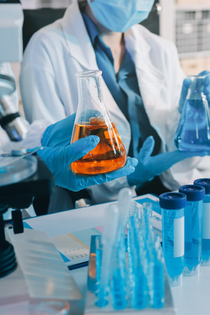 Collaboration, tablet or science with people in lab together for research or development. Innovation, tech and microscope with scientist team in clinical trial for planning or medical investigationの写真素材