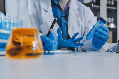 Collaboration, tablet or science with people in lab together for research or development....