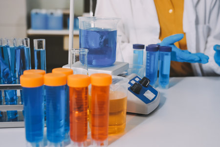 Collaboration, tablet or science with people in lab together for research or development. Innovation, tech and microscope with scientist team in clinical trial for planning or medical investigationの写真素材