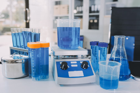 Collaboration, tablet or science with people in lab together for research or development. Innovation, tech and microscope with scientist team in clinical trial for planning or medical investigationの写真素材