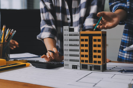 Construction and structure concept of engineer working drawing on blueprint meeting for project...