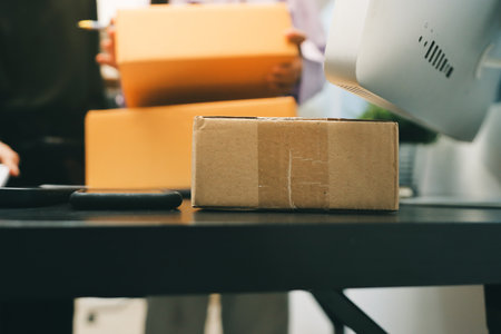 Portrait of Starting small businesses SME owners, two Asian woman check online orders Selling products working with boxs freelance work at home office, sme business online small medium enterpriseの写真素材