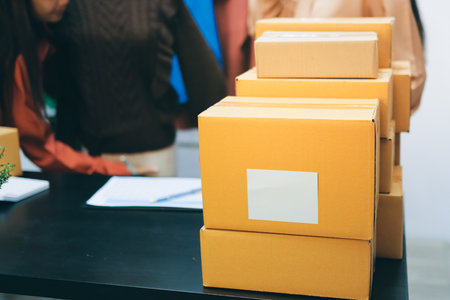 Portrait of Starting small businesses SME owners, two Asian woman check online orders Selling products working with boxs freelance work at home office, sme business online small medium enterpriseの写真素材