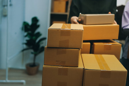 Portrait of Starting small businesses SME owners, two Asian woman check online orders Selling products working with boxs freelance work at home office, sme business online small medium enterpriseの写真素材