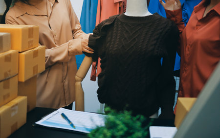 Portrait of Starting small businesses SME owners, two Asian woman check online orders Selling products working with boxs freelance work at home office, sme business online small medium enterpriseの写真素材