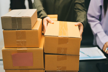 Portrait of Starting small businesses SME owners, two Asian woman check online orders Selling...