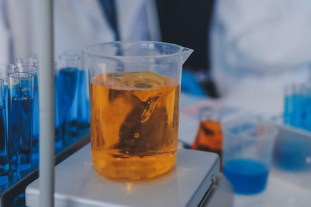 Collaboration, tablet or science with people in lab together for research or development. Innovation, tech and microscope with scientist team in clinical trial for planning or medical investigationの写真素材