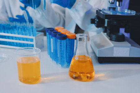 Collaboration, tablet or science with people in lab together for research or development. Innovation, tech and microscope with scientist team in clinical trial for planning or medical investigationの写真素材